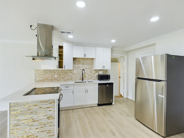 5260 Landry Ln, Beaumont, TX 77708 - kitchen featuring visible vents, island range hood, ornamental molding, a sink, and appliances with stainless steel finishes