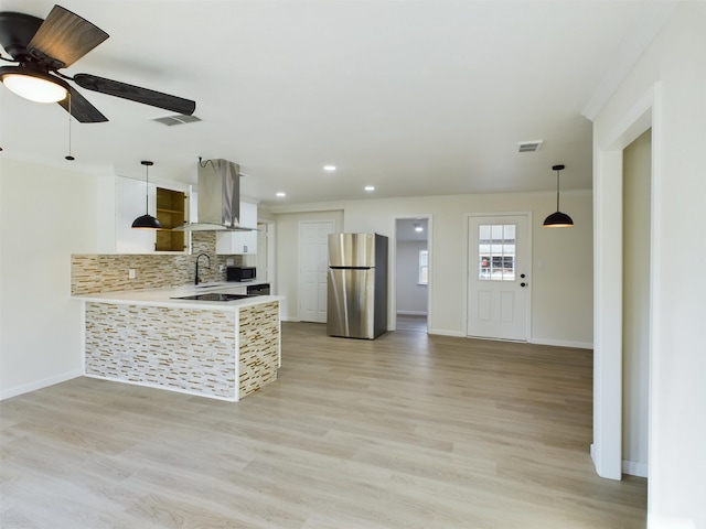 5260 Landry Ln, Beaumont, TX 77708 - kitchen featuring freestanding refrigerator, visible vents, crown molding, and island range hood