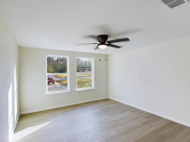 5260 Landry Ln, Beaumont, TX 77708 - unfurnished room featuring ceiling fan, baseboards, light wood finished floors, and visible vents