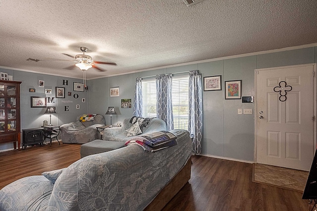 living room featuring crown molding, ceiling fan, and dark wood-type flooring