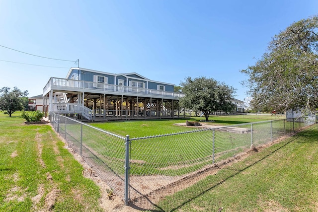 view of front facade with a front yard and a deck