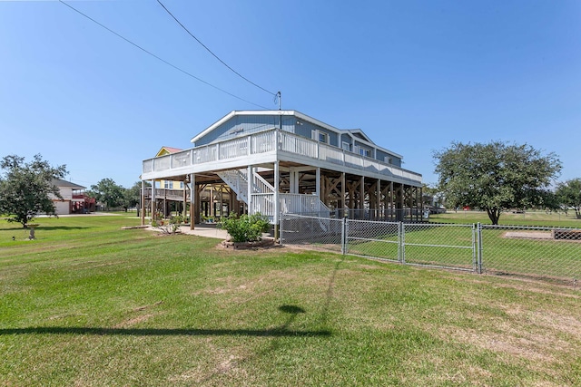 rear view of property with a yard