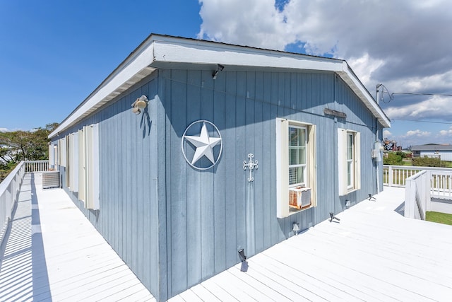 view of home's exterior featuring a wooden deck