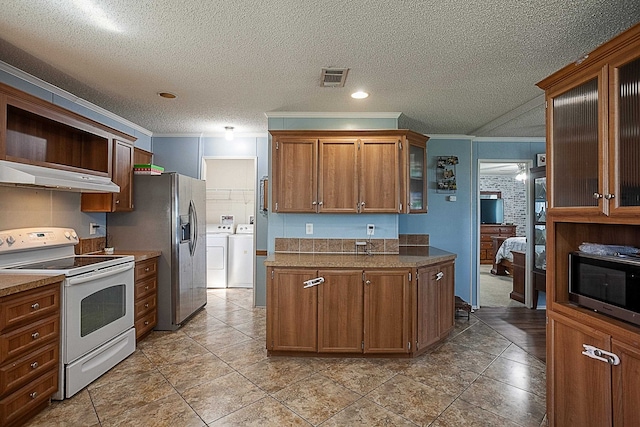 kitchen with stainless steel refrigerator with ice dispenser, ornamental molding, white electric range oven, a textured ceiling, and separate washer and dryer