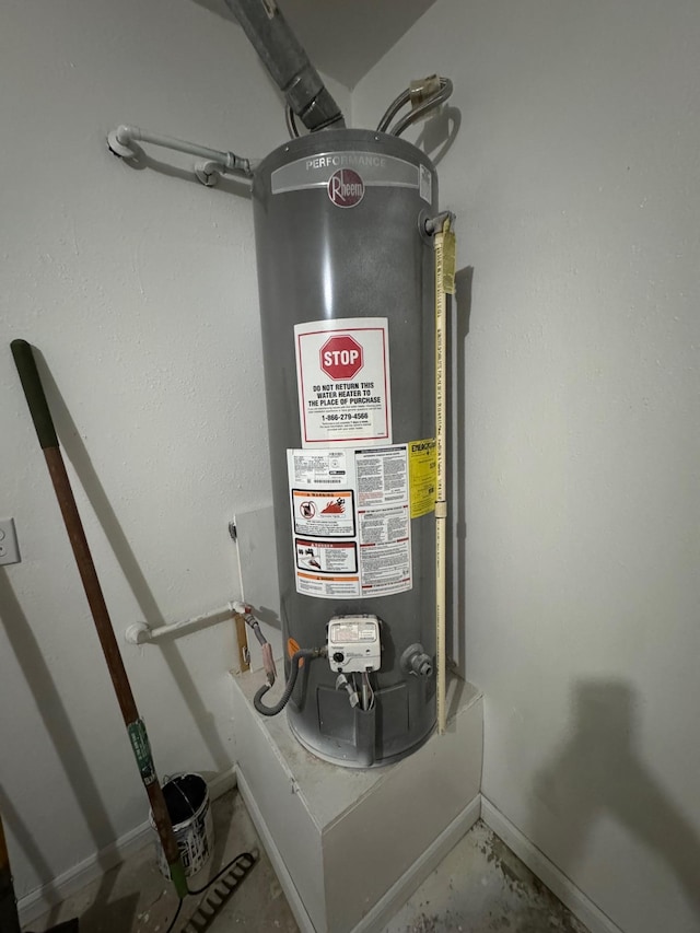 utility room featuring water heater