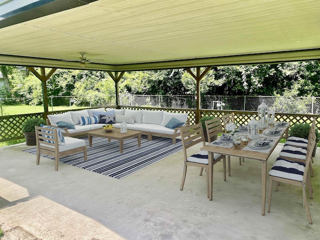 1113 Railroad, Silsbee, TX 77656 - fenced backyard featuring an outdoor hangout area, outdoor dining area, a patio, and view of scattered trees