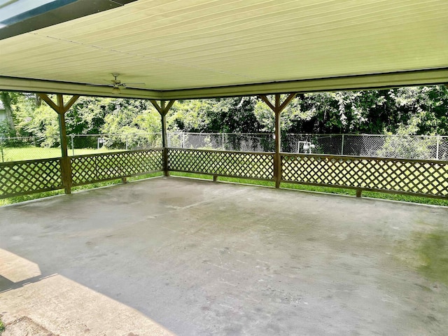 1113 Railroad, Silsbee, TX 77656 - view of patio / terrace with a ceiling fan and view of wooded area