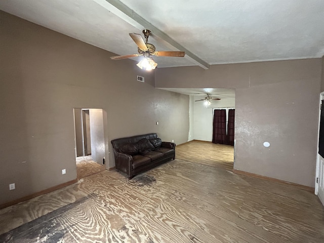 living room featuring vaulted ceiling with beams