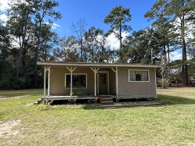 view of front of property with a front yard and a porch