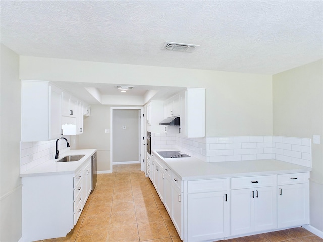 kitchen featuring decorative backsplash, sink, white cabinets, and appliances with stainless steel finishes