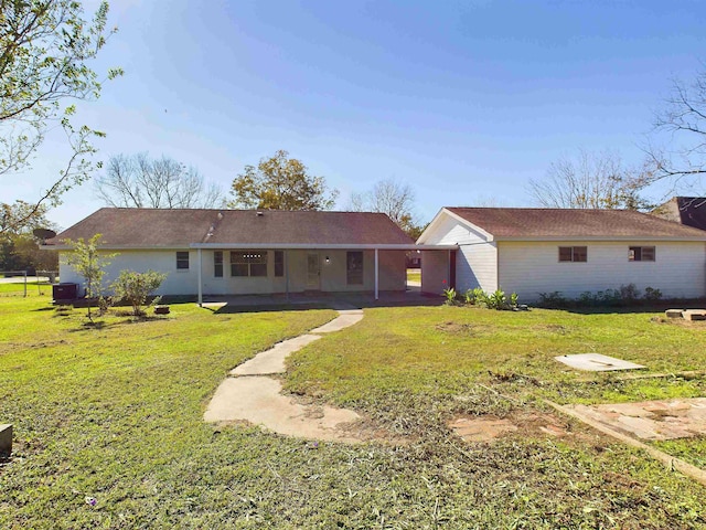 rear view of property with a porch and a yard