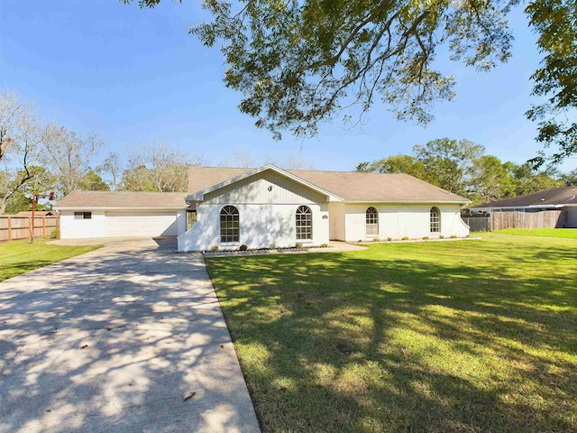 single story home with a front yard and a garage