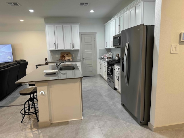 3040 Allie Payne, Orange, TX 77632 - kitchen with a sink, visible vents, open floor plan, and appliances with stainless steel finishes