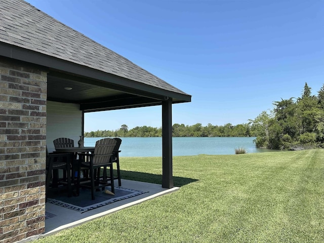 3040 Allie Payne, Orange, TX 77632 - view of yard featuring a patio area and a water view