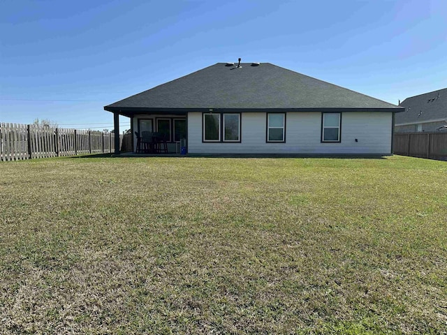 3040 Allie Payne, Orange, TX 77632 - rear view of property with roof with shingles, a yard, and a fenced backyard
