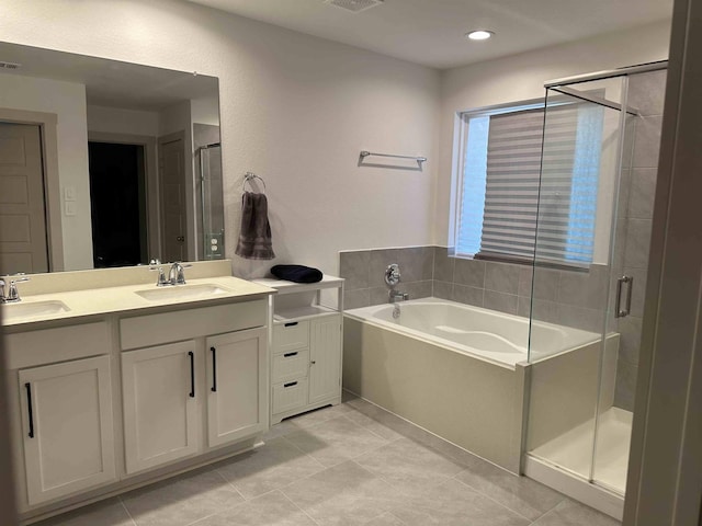 3040 Allie Payne, Orange, TX 77632 - bathroom with a stall shower, a garden tub, double vanity, and a sink