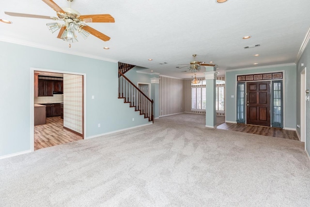 unfurnished living room featuring light colored carpet and crown molding