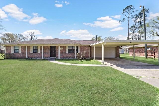 5285 Rosemary Dr, Beaumont, TX 77708 - ranch-style house featuring a carport, brick siding, a garage, and a front lawn