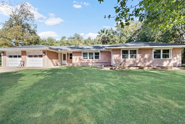 ranch-style home featuring a front yard and a garage