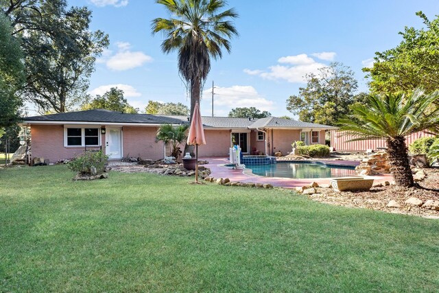 rear view of house with a lawn