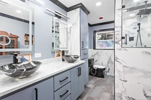 bathroom with vanity, a shower with shower door, tile walls, and ornamental molding