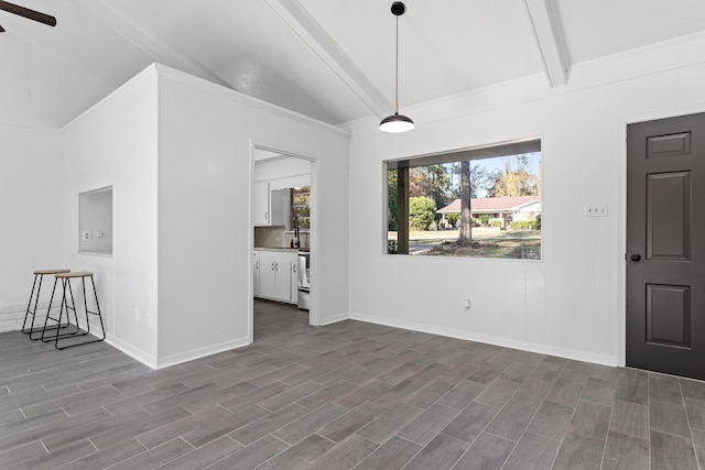 foyer entrance featuring beamed ceiling, ceiling fan, and high vaulted ceiling