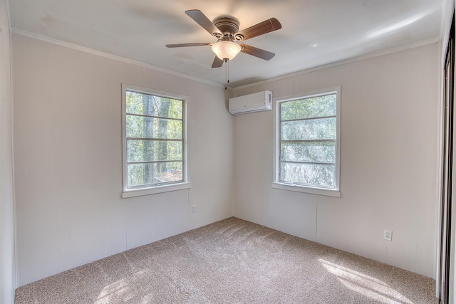 empty room featuring a wall mounted air conditioner, carpet flooring, a ceiling fan, and ornamental molding