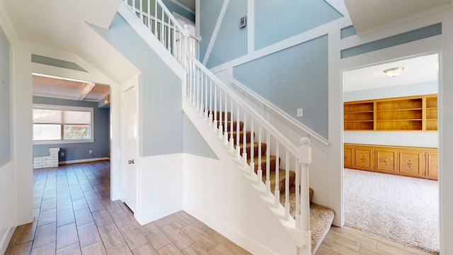 staircase featuring wood finished floors