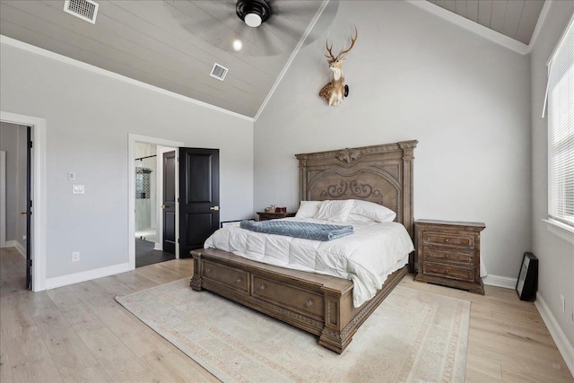 bedroom featuring lofted ceiling, wood finished floors, visible vents, and crown molding