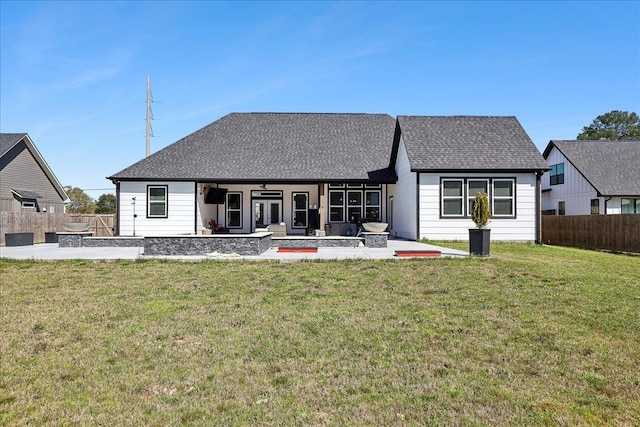 back of house featuring a patio, a lawn, fence, and a ceiling fan