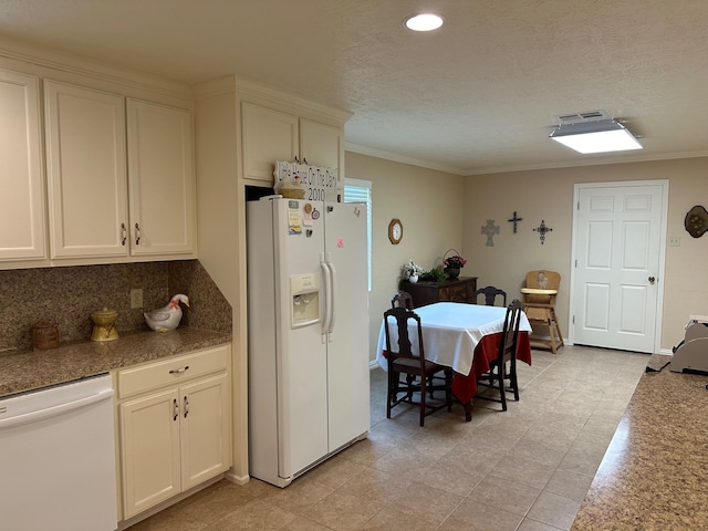 kitchen with a textured ceiling, white appliances, white cabinetry, and ornamental molding