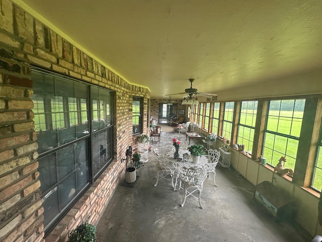 sunroom / solarium with ceiling fan