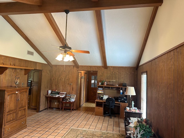 office area with high vaulted ceiling, ceiling fan, wooden walls, and light tile patterned flooring