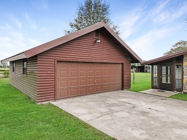 garage with a lawn