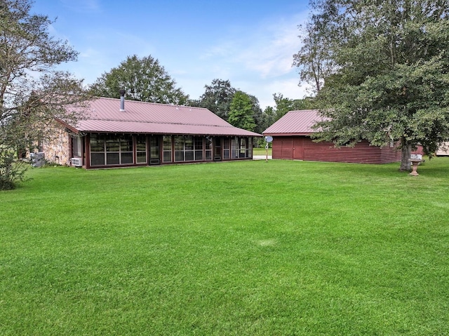 view of yard with a sunroom