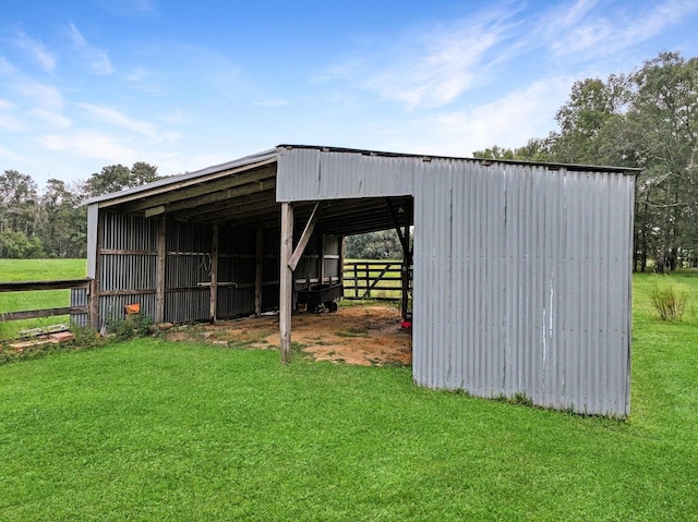 view of outbuilding featuring a lawn