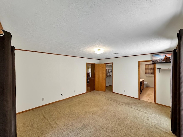 interior space featuring a textured ceiling and ornamental molding