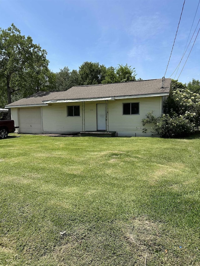 2910 Dowling St, Orange, TX 77630 - view of front of house with a front yard and a garage