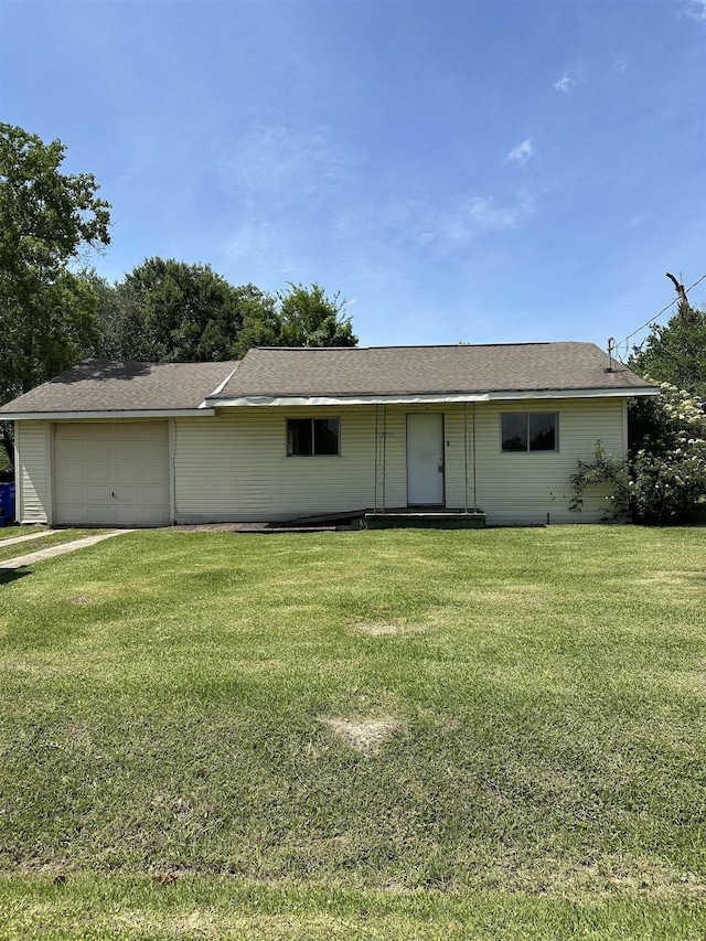 2910 Dowling St, Orange, TX 77630 - view of front of property with a front lawn and an attached garage
