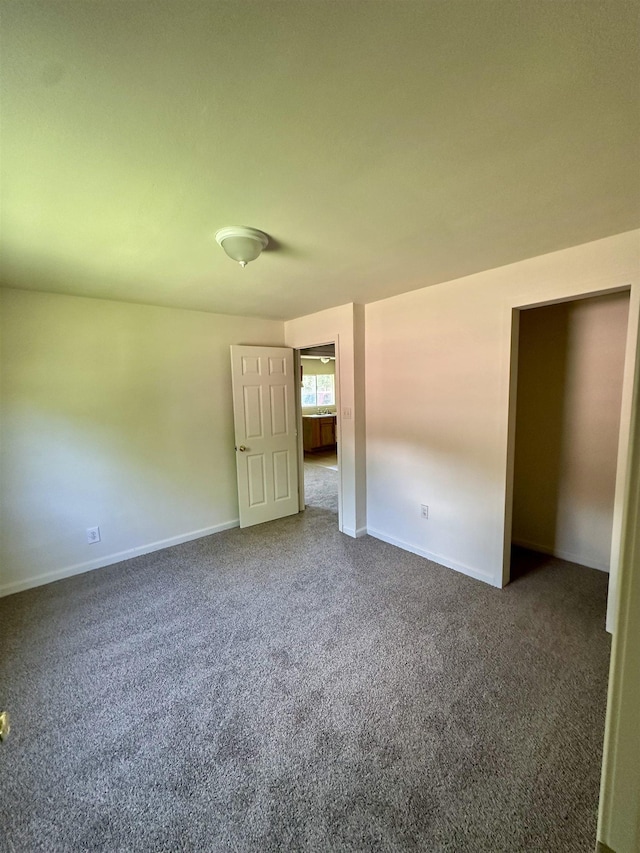 2910 Dowling St, Orange, TX 77630 - unfurnished room with dark colored carpet and baseboards