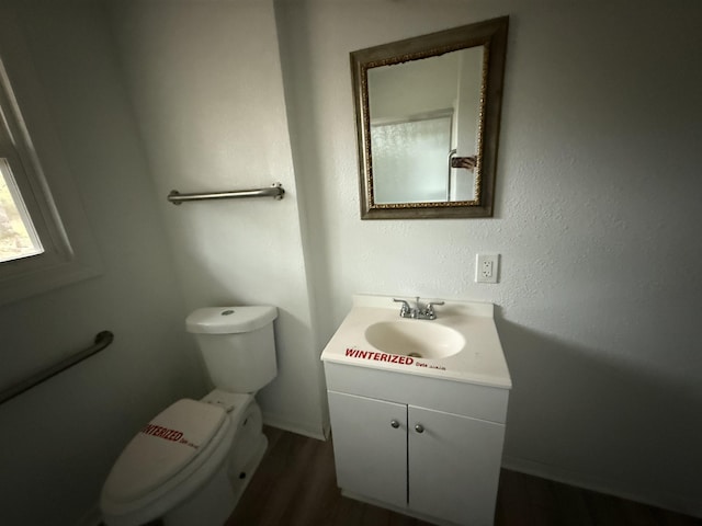 3190 Shivers St, Vidor, TX 77662 - bathroom with vanity and wood finished floors