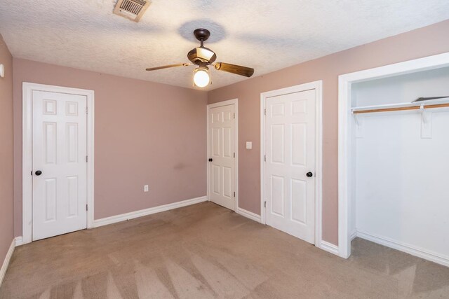 970 Charleston Cir, Bridge City, TX 77611 - unfurnished bedroom with carpet floors, ceiling fan, and a textured ceiling