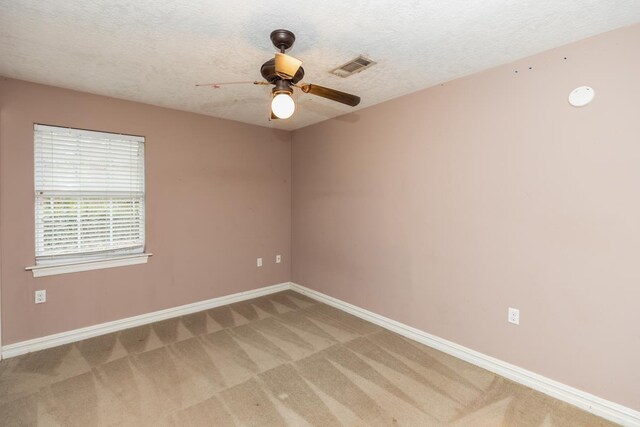 970 Charleston Cir, Bridge City, TX 77611 - spare room with light colored carpet, a ceiling fan, and a textured ceiling