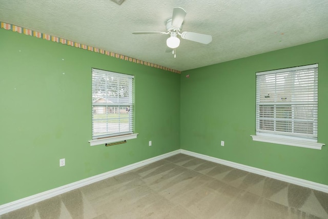 970 Charleston Cir, Bridge City, TX 77611 - carpeted spare room with a textured ceiling and a ceiling fan