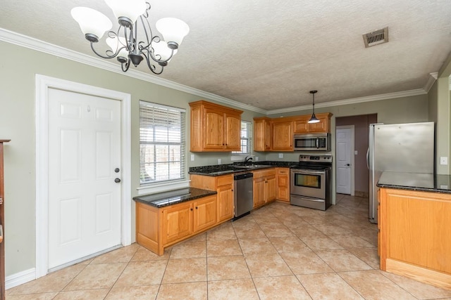 970 Charleston Cir, Bridge City, TX 77611 - kitchen featuring appliances with stainless steel finishes, a chandelier, crown molding, hanging light fixtures, and light tile patterned floors