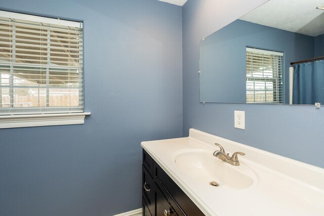 970 Charleston Cir, Bridge City, TX 77611 - full bath with vanity and a shower with shower curtain