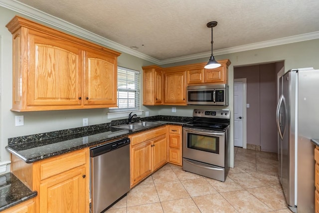 970 Charleston Cir, Bridge City, TX 77611 - kitchen featuring stainless steel appliances, ornamental molding, pendant lighting, dark stone countertops, and light tile patterned flooring
