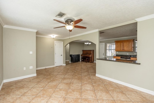 970 Charleston Cir, Bridge City, TX 77611 - unfurnished living room featuring arched walkways, ceiling fan, ornamental molding, light tile patterned flooring, and a textured ceiling