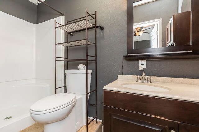 970 Charleston Cir, Bridge City, TX 77611 - full bath with a shower, vanity, a textured wall, and a ceiling fan