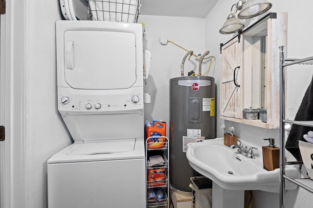 1165 Archie St, Vidor, TX 77662 - laundry area with electric water heater and stacked washing machine and dryer